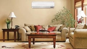 A living room with a wall mounted air conditioner.