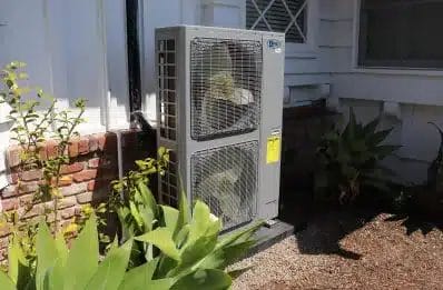An air conditioning unit outside of a house.